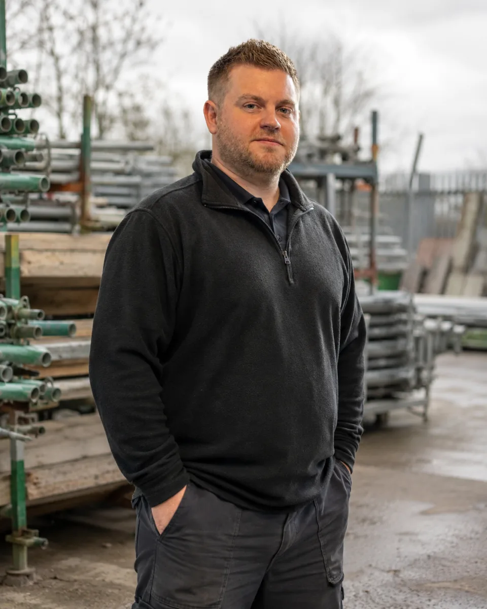Mark Wilson in a scaffolding yard